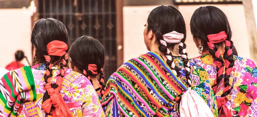 Women with typical braids and clothing of the Guatemalan culture